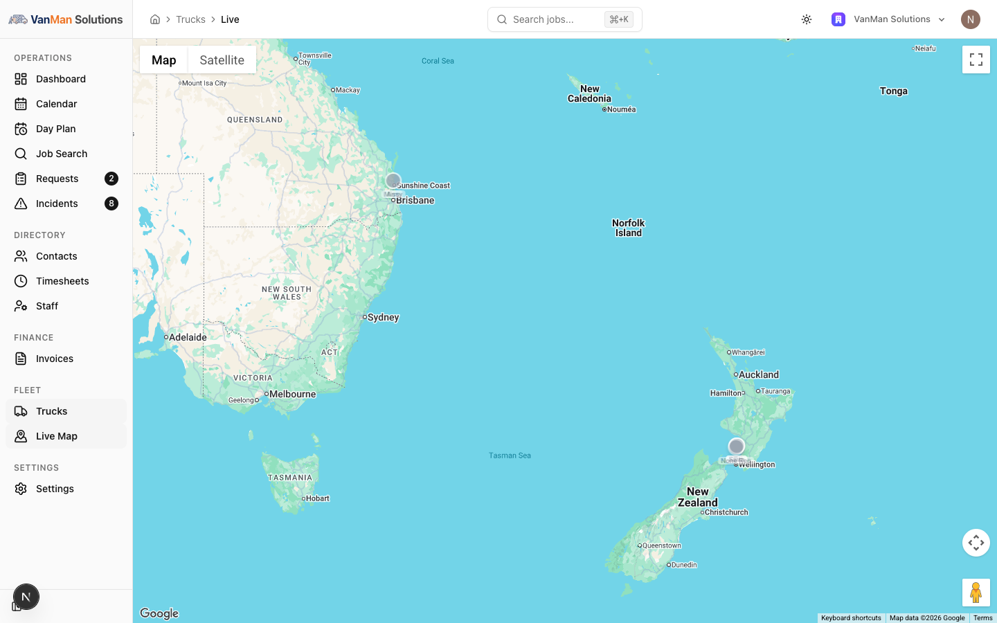 The Live Map showing a full-screen Google map with truck markers, each labelled with its truck name, and Map and Satellite view buttons.